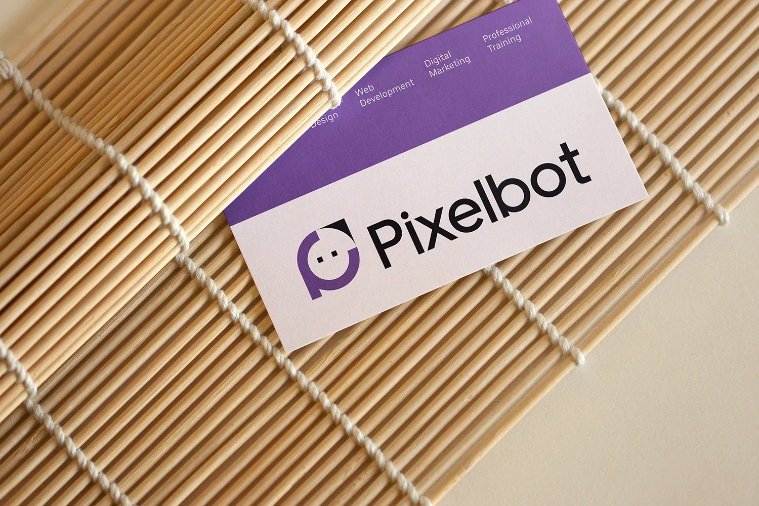 A creative's desk with a laptop, design sketches, and coffee.